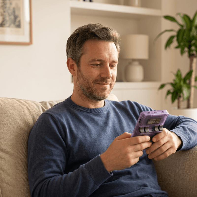 Person playing the ahonor Pro 2.0 R36S retro gaming console at home